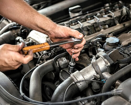 A mechanic working on a car