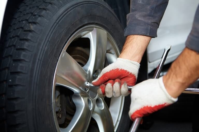 A mechanic changing a tyre